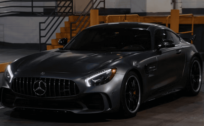 A sports car under studio lighting after a full detail
